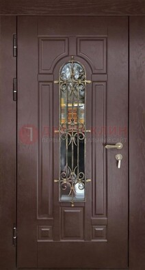Темная железная дверь со стеклом и ковкой для частного дома ДСК-156 в Санкт-Петербурге